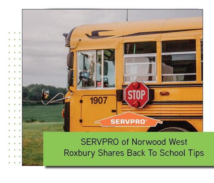 School bus with orange SERVPRO logo