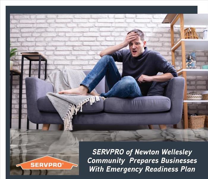 Person with flood in background and blue text box with orange SERVPRO logo 
